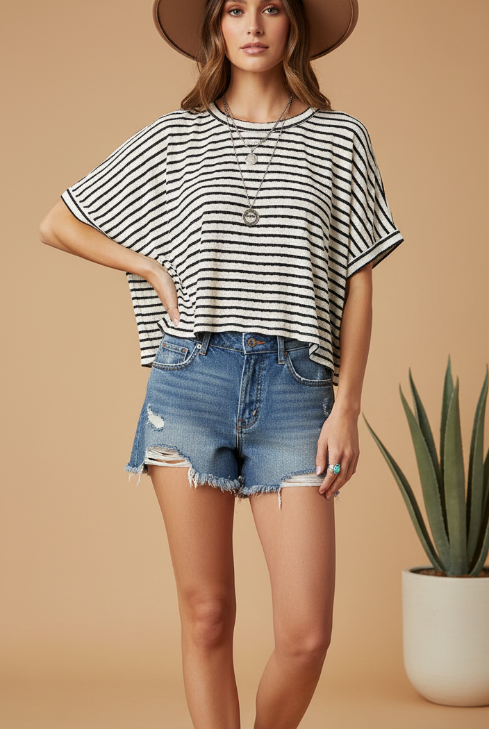 Cropped black and white striped top on model