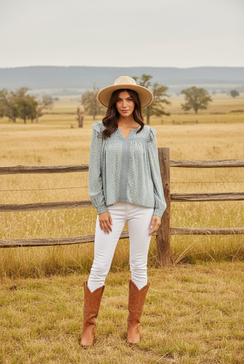 Light blue floral peasant top with eyelet lace details and western boho ranch background