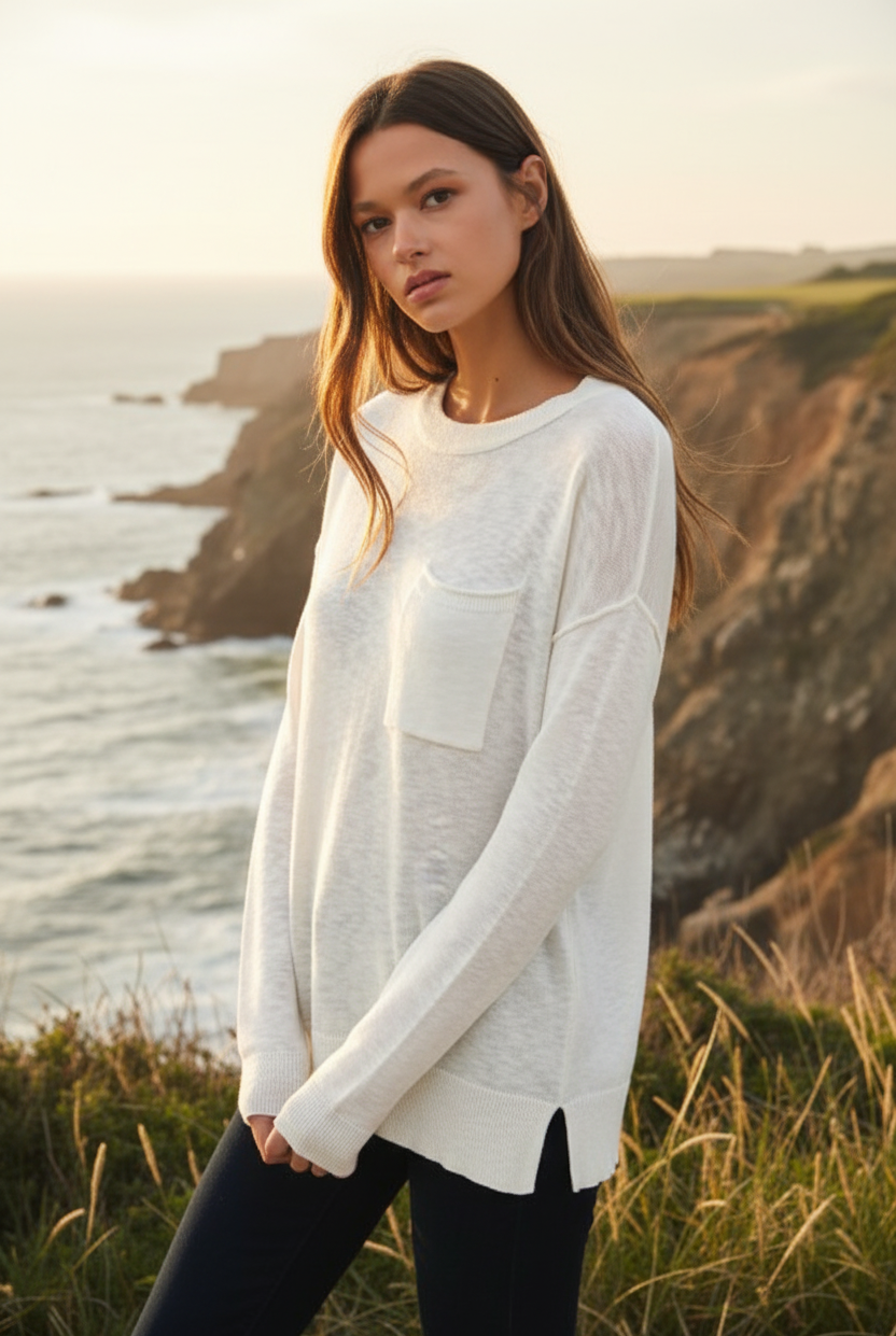 White distressed long sleeve tee with coastal cliff background - closer view