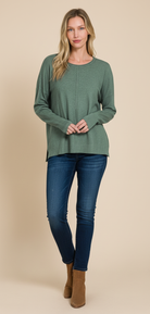 Ash jade green textured sweater on model