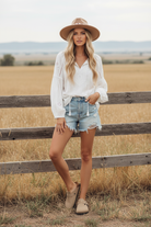 Beige buckle clogs with western boho ranch background