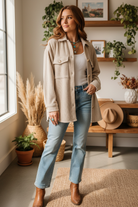 Beige corduroy shacket on model with interior background