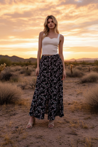 Black and white floral print maxi skirt with desert sunset landscape
