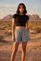 Black and white gingham check shorts with alternate desert landscape