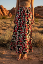 Black floral print maxi skirt with desert landscape