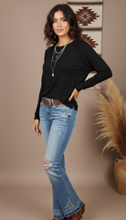 Black long-sleeve top on model