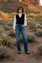 Black sweater vest with desert landscape