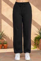 Black sweatpants with southwestern background