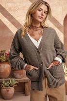 Brown cardigan with textured southwestern background