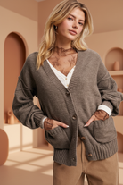 Brown cardigan with warm boutique background