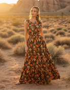 Brown floral print maxi dress with desert landscape