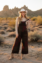 Burgundy and green tie-dye jumpsuit on model with outdoor background
