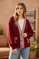 Burgundy candy cane cardigan on model - no collar