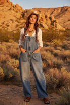 Denim overalls with desert landscape