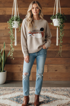 Duck sweater on model with styled background
