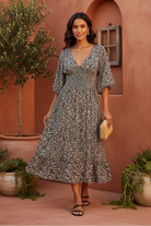 Floral midi dress with terracotta backdrop