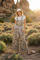 Floral print overalls with desert landscape