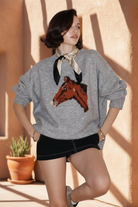 Gray horse sweater with southwestern background