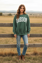 Green OREGON graphic sweatshirt with mineral wash finish and western boho ranch background