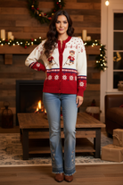 Holiday cardigan on model with cozy holiday background