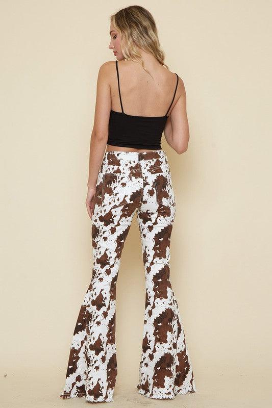 KAYDENCE COWPRINT FLARED DENIM PANTS - West End Boutique