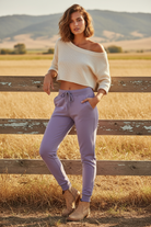 Lavender french terry joggers with western boho ranch background