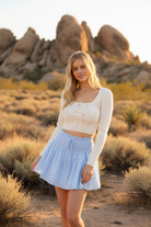 Light blue eyelet mini skirt with desert landscape