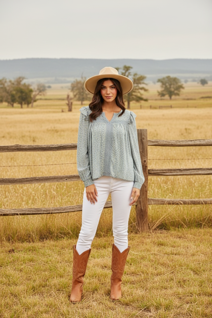 Light blue floral peasant top with eyelet lace details and western boho ranch background