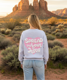 Light gray sweatshirt with Spread The Love Of Jesus back graphic and desert landscape