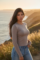 Mocha long sleeve crop top with coastal cliff background - closer view