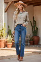 Mocha textured top on model with styled background