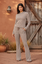 Striped hooded top and flare pants set on model