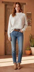 Taupe beige camo sweatshirt on model with styled background