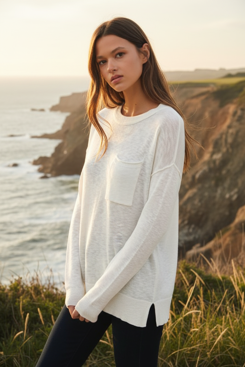 White distressed long sleeve tee with coastal cliff background - closer view