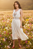 White embroidered dress in floral field