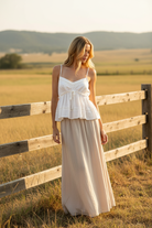 White eyelet babydoll cami top with maxi skirt and western boho ranch background