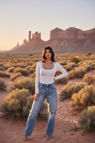 White long sleeve fitted top with desert landscape