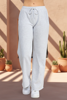 White sweatpants with southwestern background